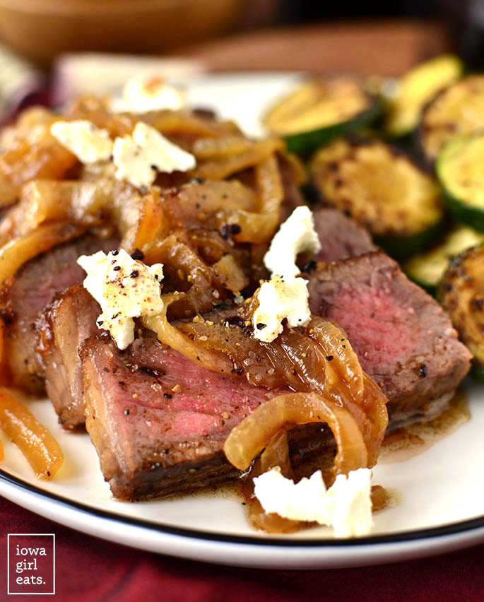 Pan-Roasted Steak with Caramelized Onions and Goat Cheese is decadent beyond measure! Perfect for date night or anytime you want a delicious and indulgent dinner at home. | iowagirleats.com