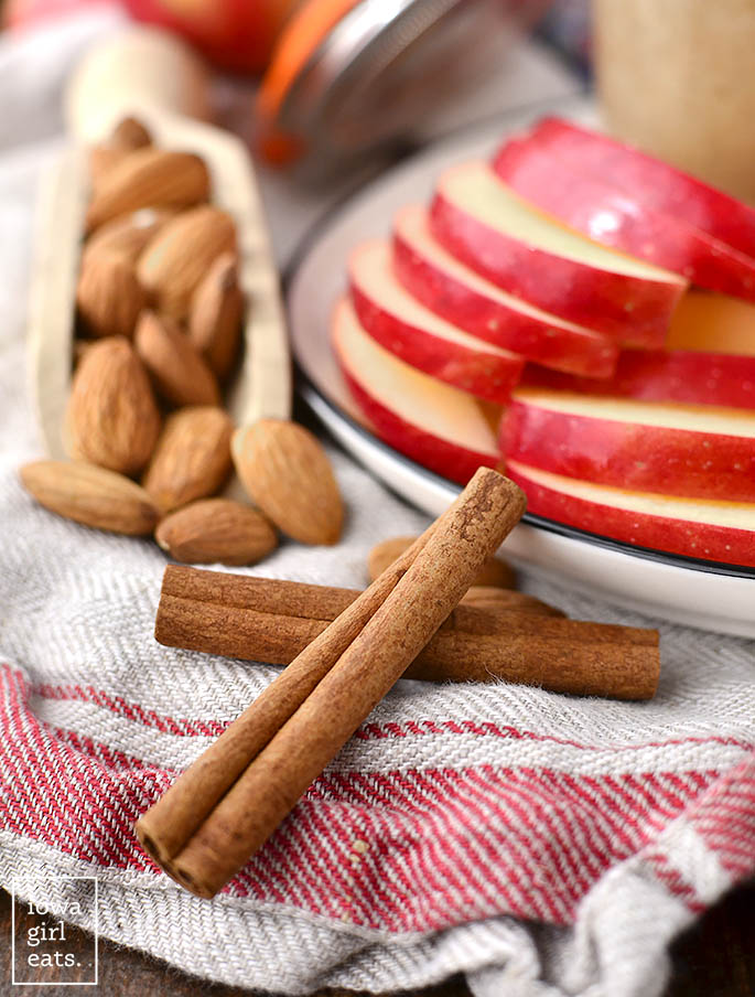 Photo of cinnamon, apples, and almonds.