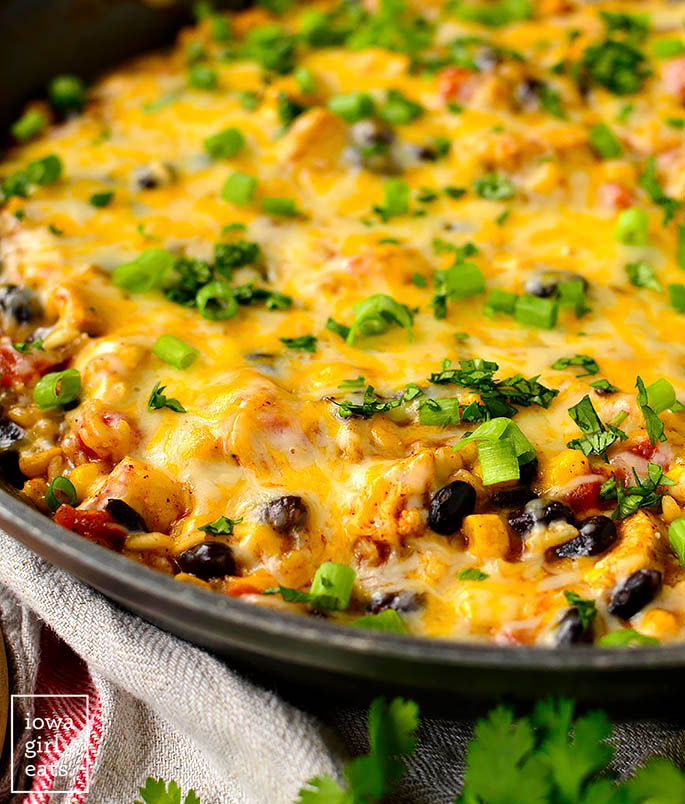 Large skillet of a cheesy chicken burrito skillet
