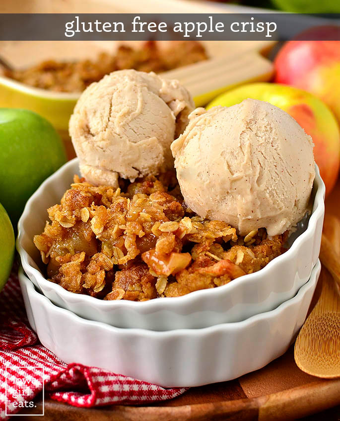 Gluten free apple crisp in bowl with two scoops of ice cream