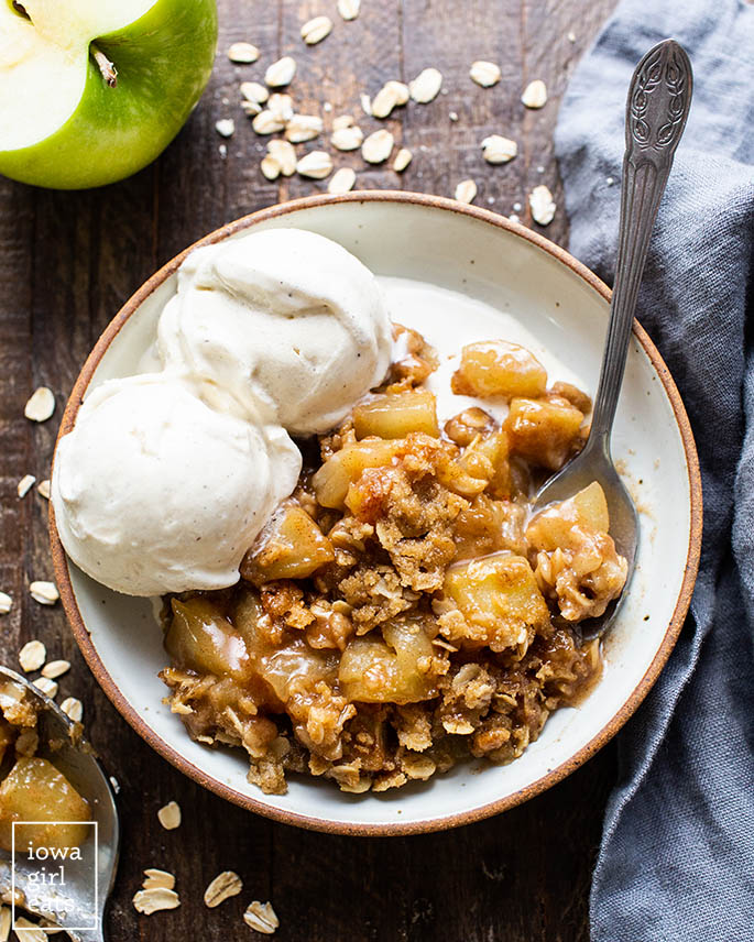 gluten free apple crisp in a bowl with ice cream