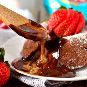 spoon dipping into chocolate peanut butter lava cakes