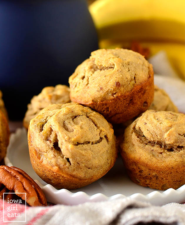 gluten free banana nut mini muffins stacked on a plate