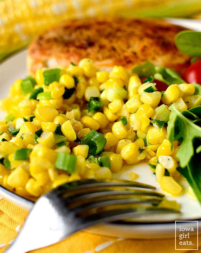 scoop of summer sweet corn saute side dish on a plate