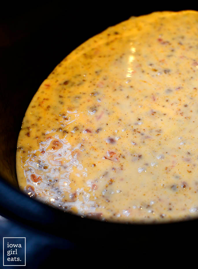 Crock pot with Chorizo Queso Dip in it