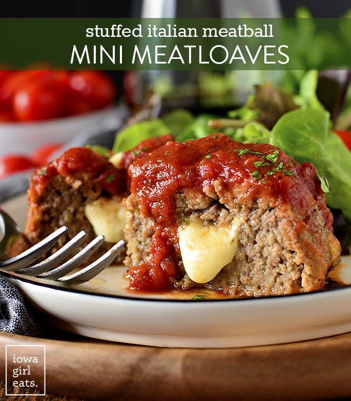 Stuffed Italian Meatball Mini Meatloaves cut in half with cheese oozing out.