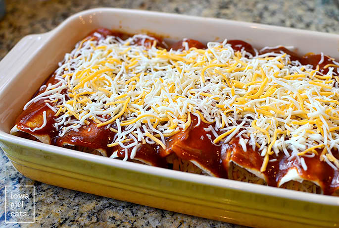 Unbaked cheese enchiladas in a casserole dish
