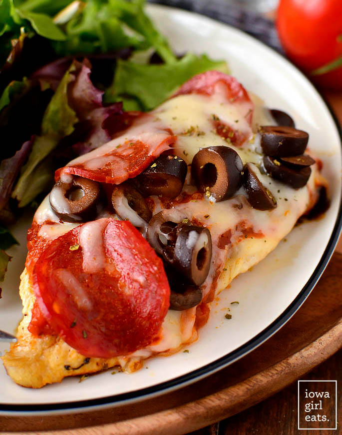 cheesy pizza chicken on a plate