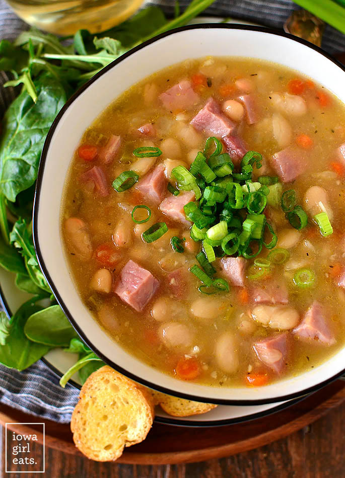 overhead photo of ham and bean soup with green onions