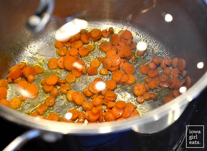 carrots sauting in a pot with butter
