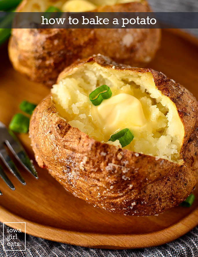 Baked potato with butter and green onions