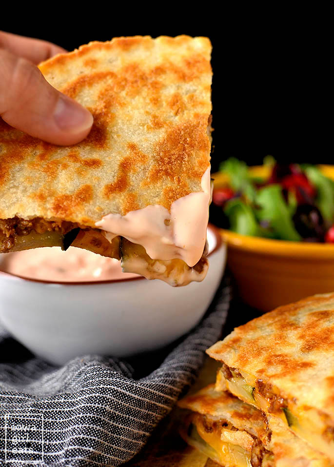 Cheeseburger Quesadilla dunked into special sauce