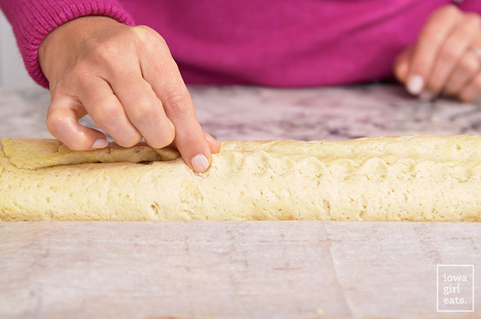 pinching gluten free cinnamon roll dough closed