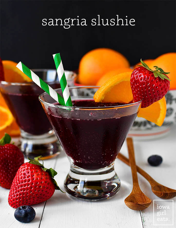 sangria slushies in glasses with a straw
