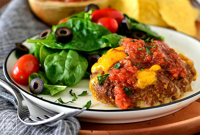 Mini meatloaf on a plate with salad