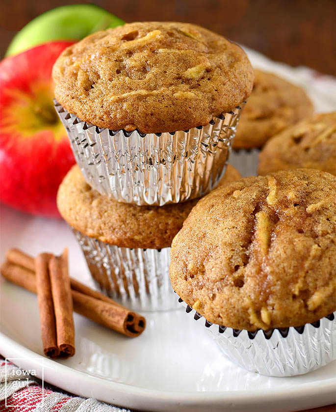 Gluten Free Apple Muffins stacked on top of each other on a plate