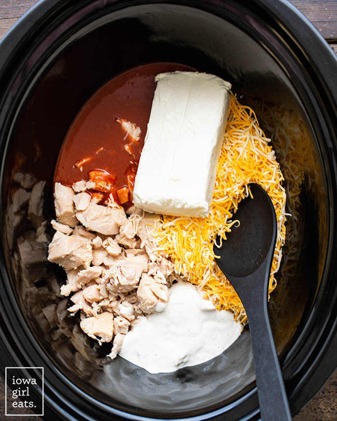 ingredients for buffalo chicken dip recipe in a crock pot