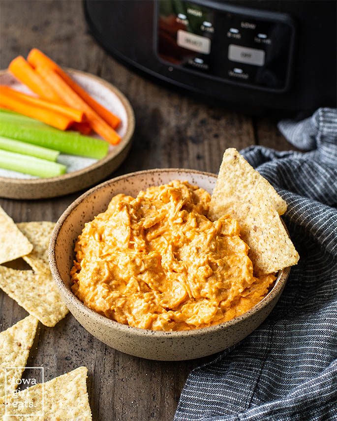 crock pot buffalo chicken dip in a bowl with chips