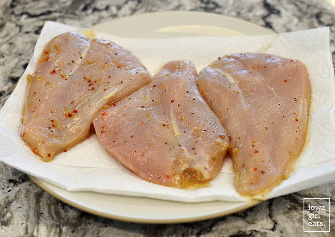 marinated chicken breasts on a plate
