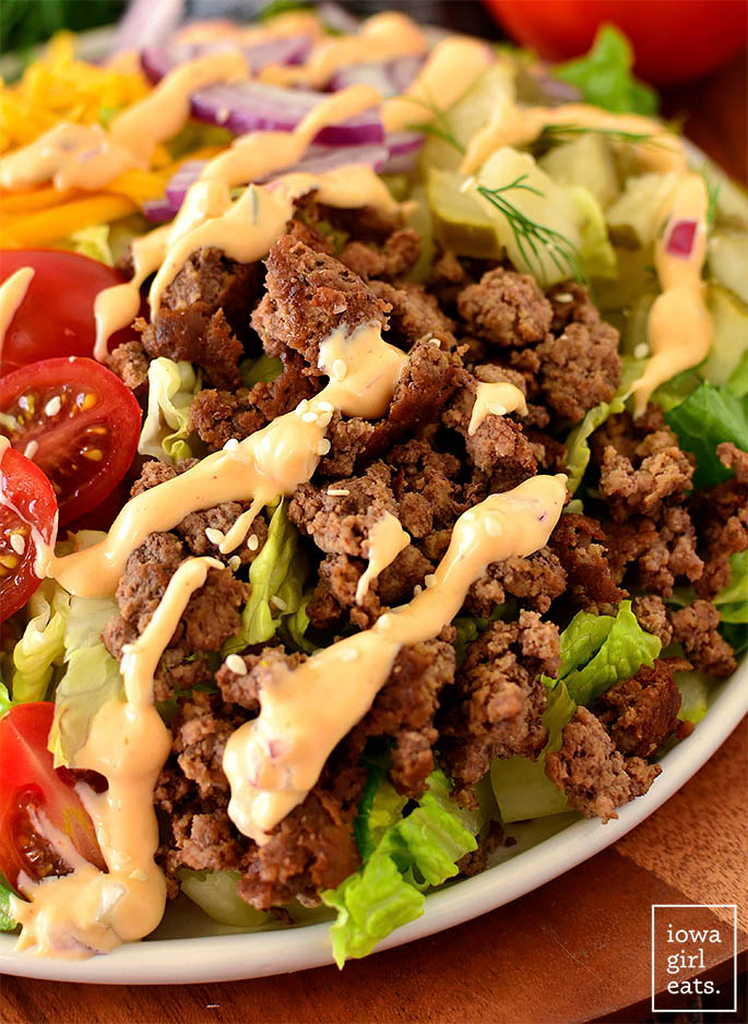 ground beef on a salad with special sauce salad dressing
