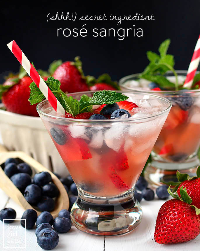 rose sangria in glasses with fruit garnish