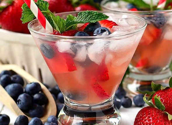 rose sangria with fresh fruit and mint in a glass