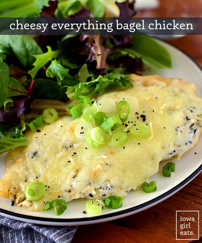 cheesy everything bagel chicken on a plate with a salad
