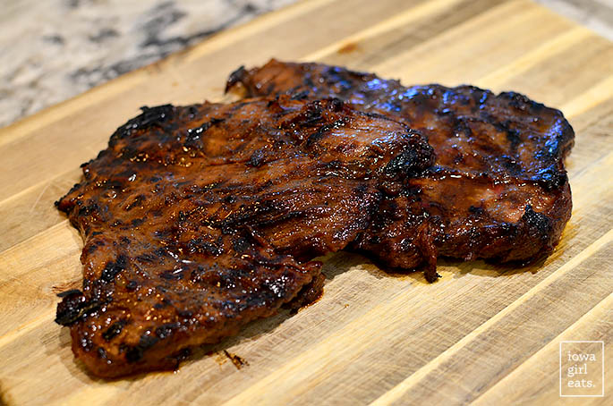grilled flank steak on a cutting board