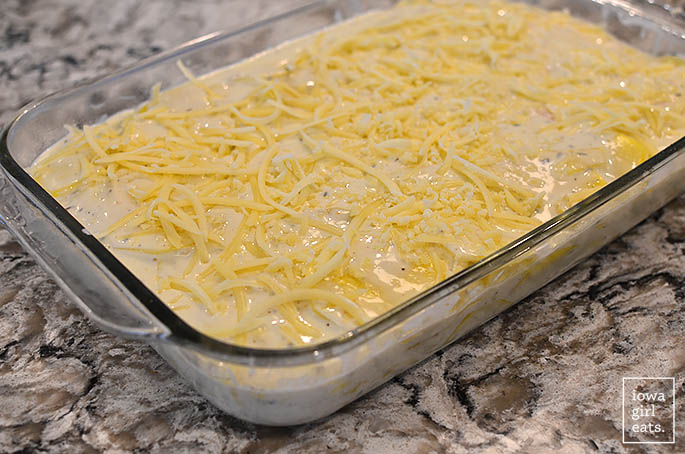 ingredients for gluten free scalloped potatoes layered in a baking dish