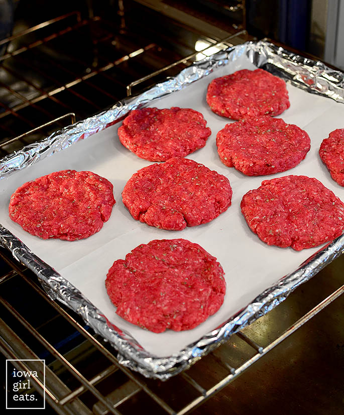 burgers on a baking sheet