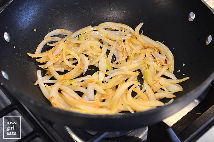 onions garlic and ginger sauting in a wok