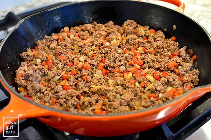 ground beef and bell pepper sauting in a skillet