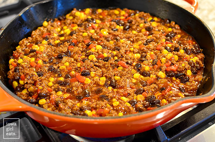 beef and vegetable enchilada filling sauting in a skillet