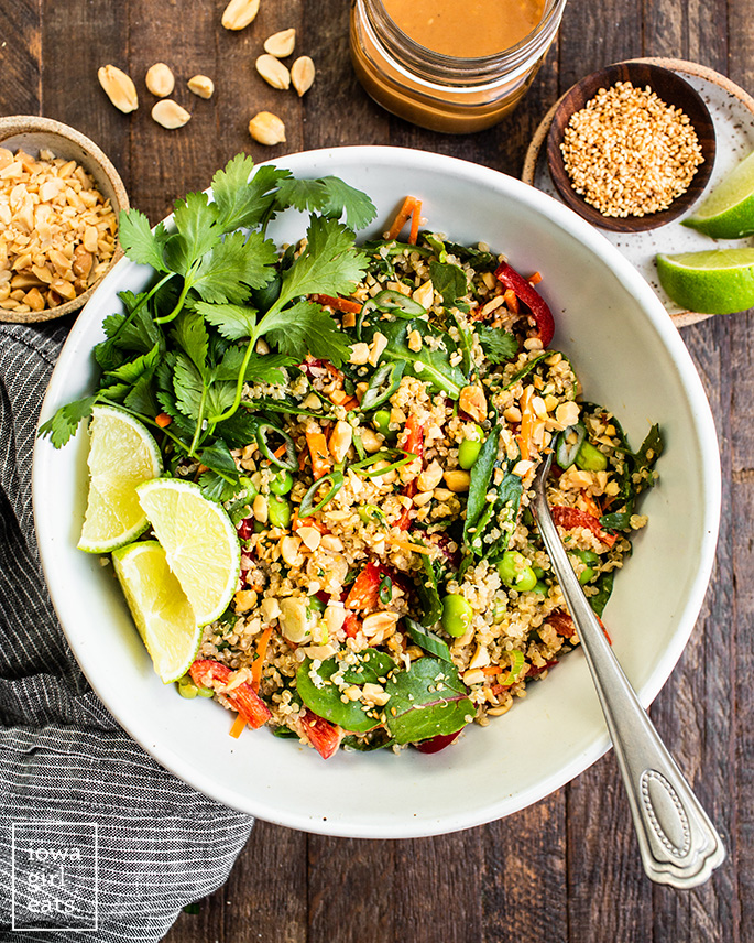 overhead photo of a bowl of thai quinoa salad with peanut dressing