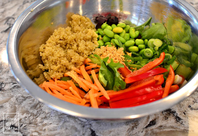 ingredients for thai quinoa salad in a mixing bowl