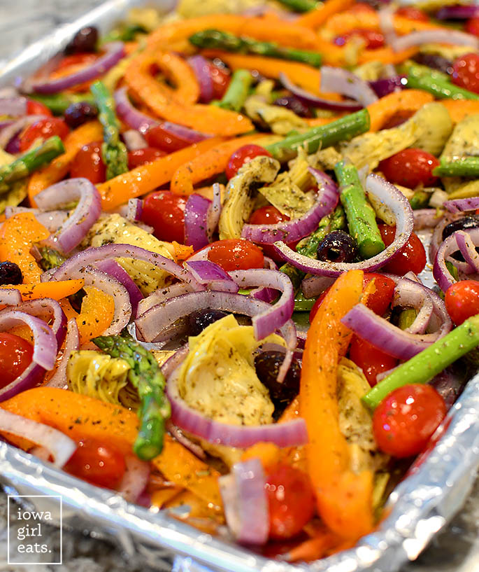 raw vegetables on a sheet pan ready to roast