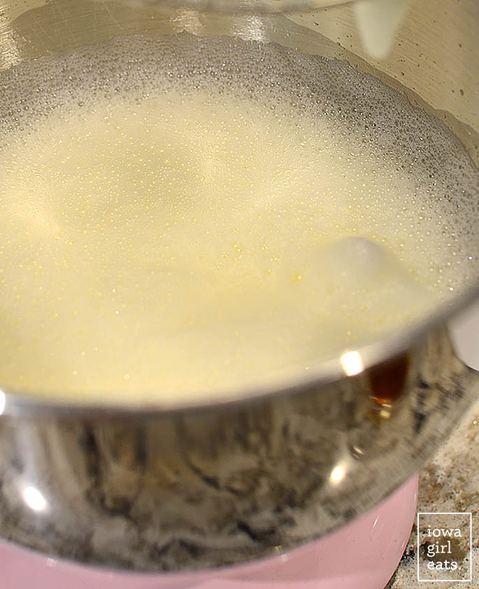 frothy egg whites in a mixing bowl