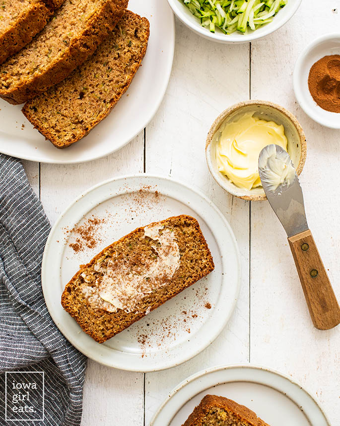 a slice of gluten free zucchini bread with butter