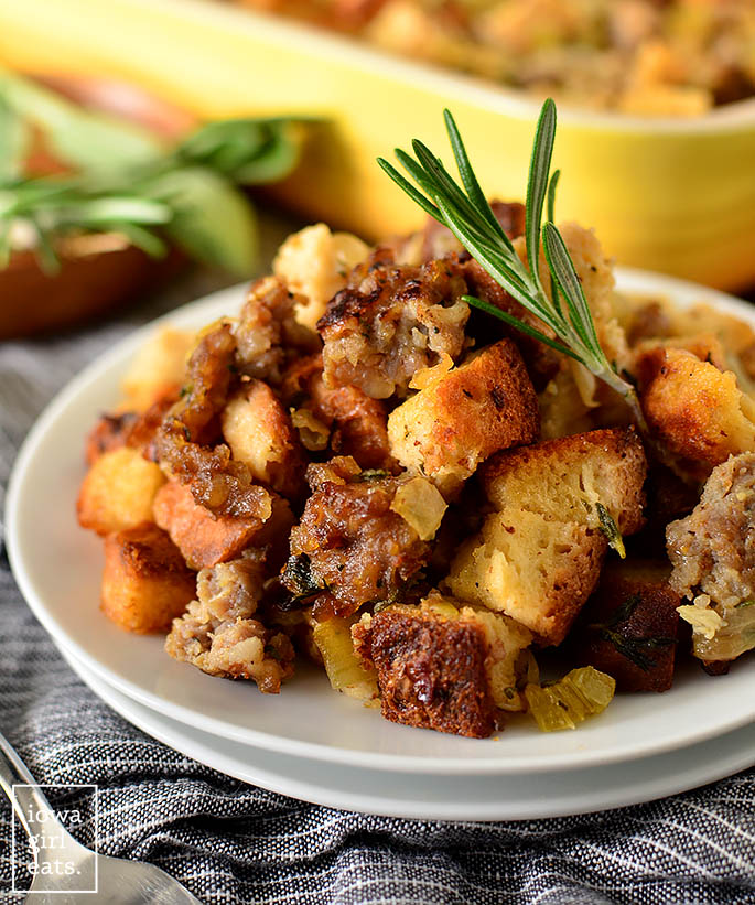 Plate of gluten-free stuffing garnished with fresh rosemary