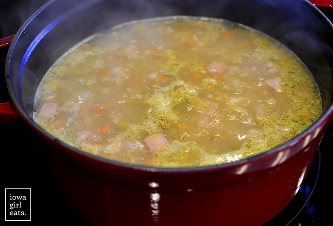 Ham and bean soup simmering in pot