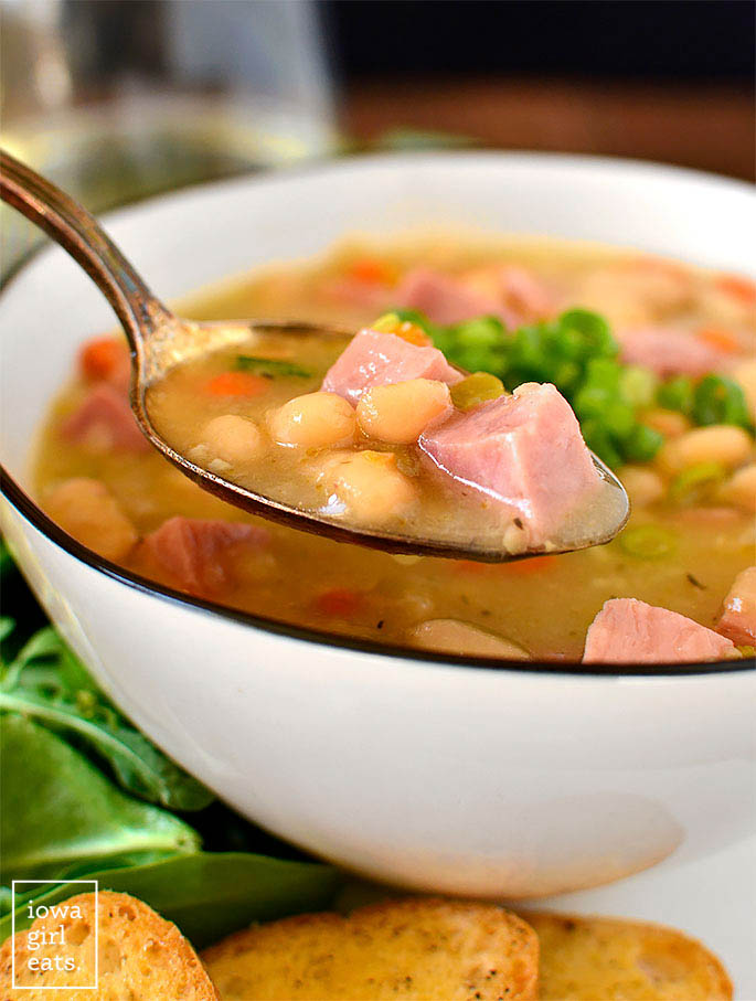 Spoonful of Ham and Bean Soup over bowl