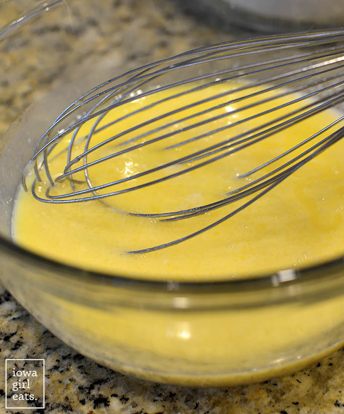 Whisking pancake batter in glass bowl