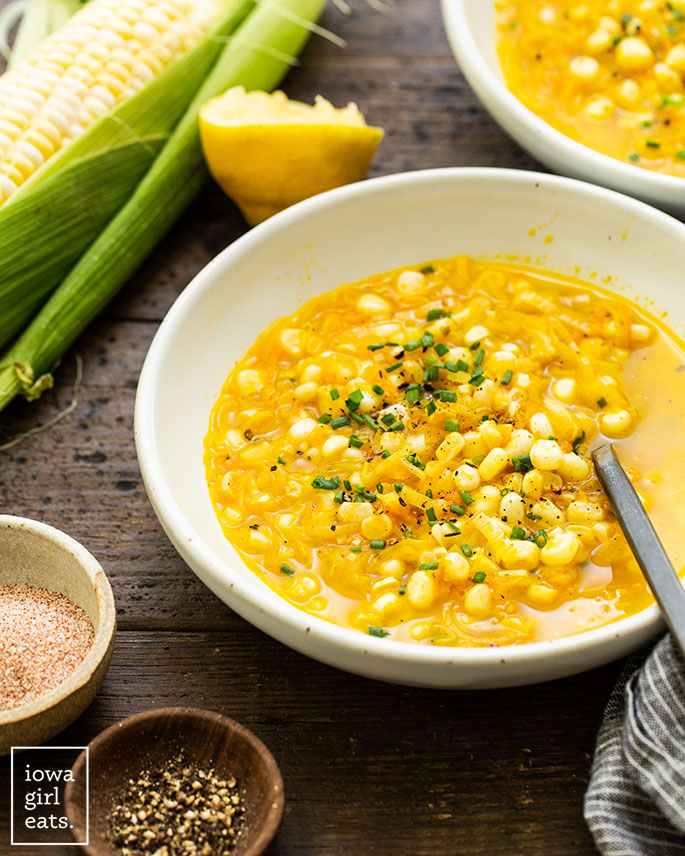 sweet corn soup with fresh herbs in a bowl