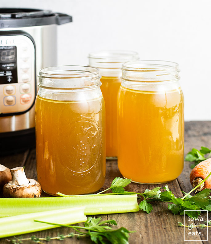 mason jars of instant pot chicken stock on the counter
