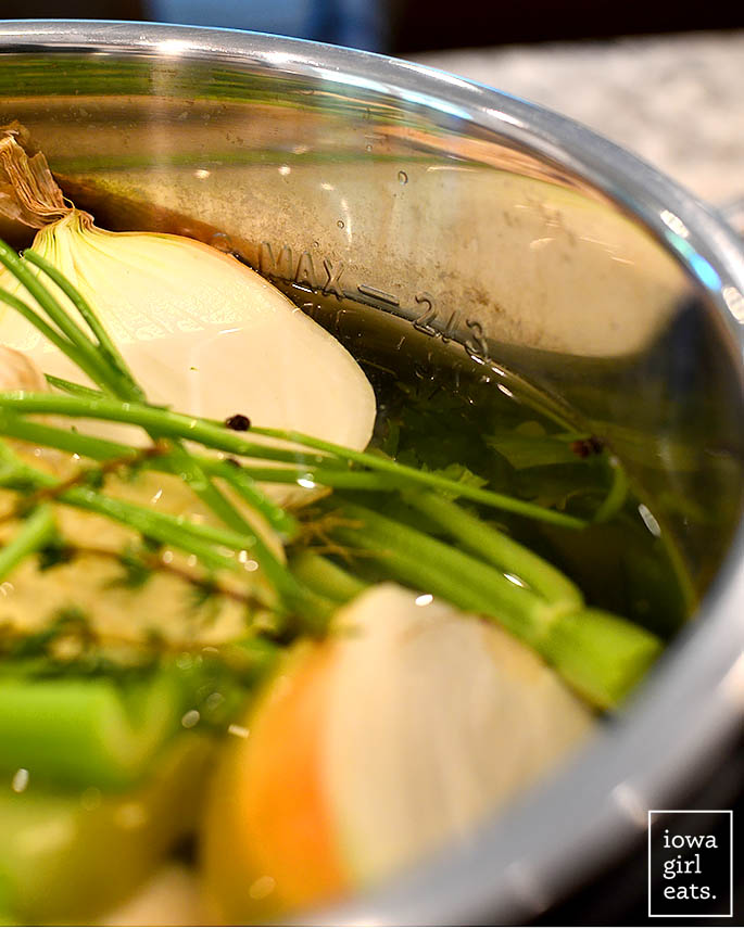an instant pot filled with water and vegetables