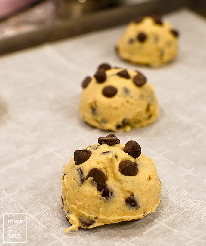 gluten free chocolate chip cookie dough balls on a cookie sheet