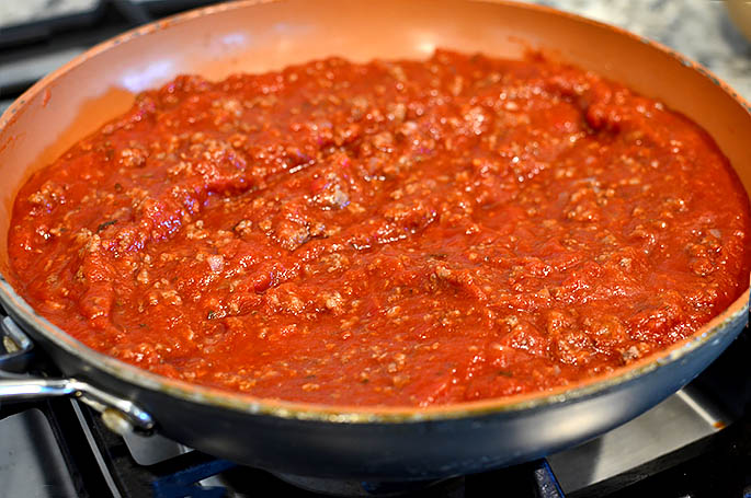 ground beef and marinara sauce in a skillet