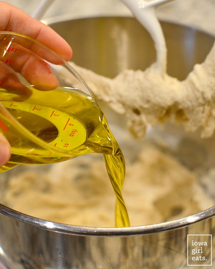 oil being added to gluten free focaccia dough