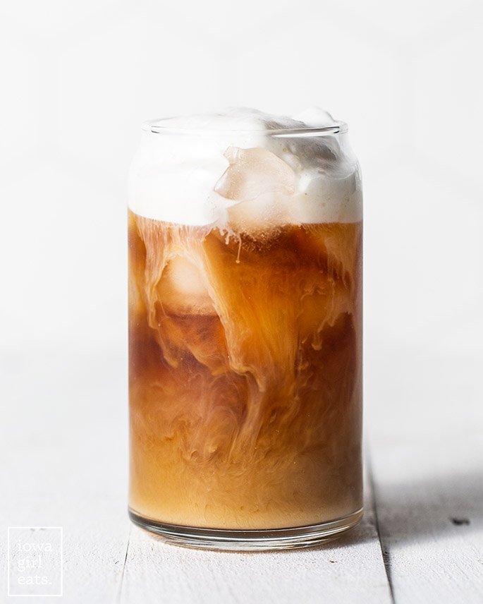glass of iced coffee with caramel cold foam
