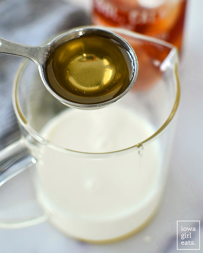 caramel simple syrup being added to milk